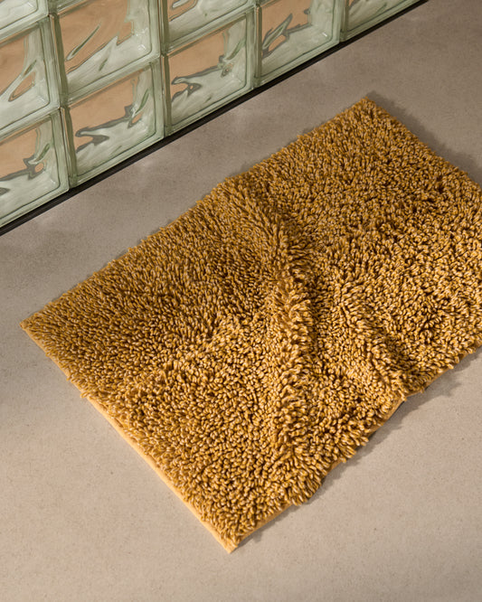 Tapis de bain Aroia bouclette effet mélangé moutarde 50 x 70 cm