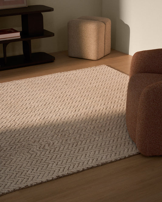 Tapis Calira en laine jacquard à motif tressé beige 230 x 160 cm