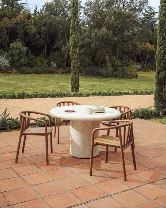 Table ronde Drasi en ciment avec finition effet travertin Ø 122 cm