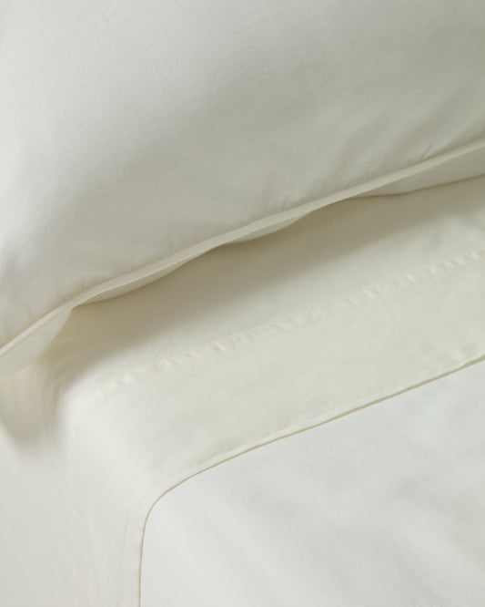 Taie d’oreiller Sirale 100 % satin de coton fini lavé blanc 45 x 110 cm